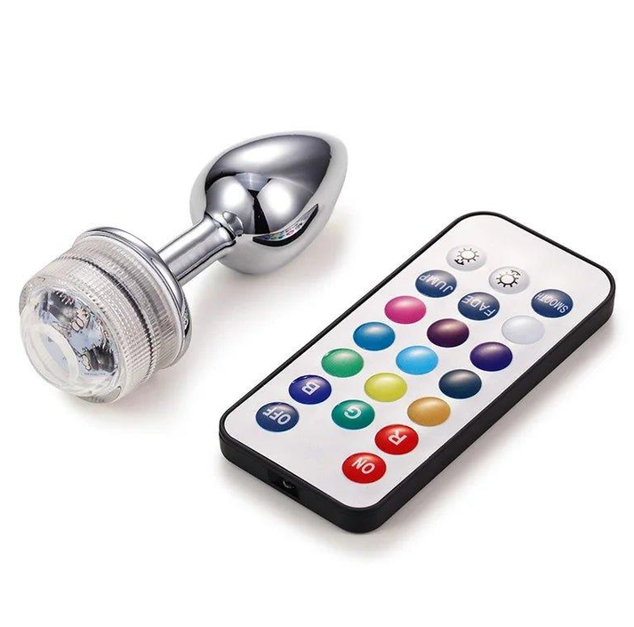 Tapered metal butt plug with attached light-up LED tail