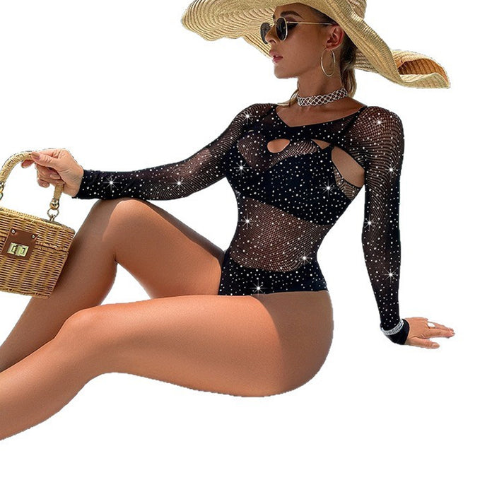 Long-sleeve sheer mesh jumpsuit with crisscross cut-outs and rhinestone embellishment