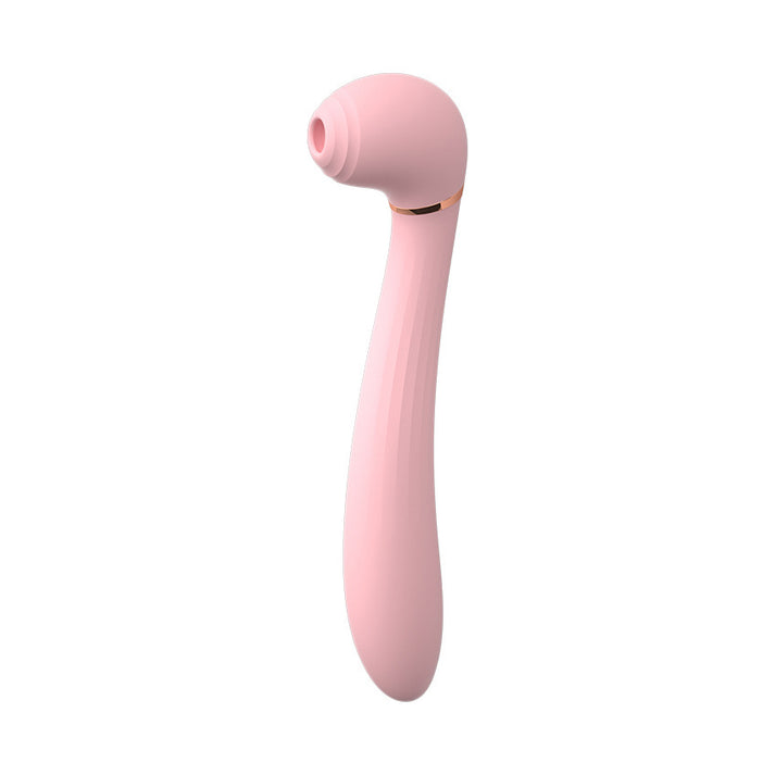 Compact silicone vibrator with a suction opening and vibrating wand tip