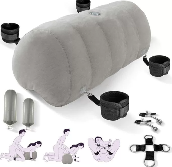 Heart-shaped inflatable sex pillow with dildo mount displayed